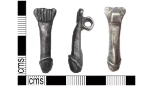 Retired Metal Detectorist Finds 2,000-Year-Old Roman Penis Pendant On An English Farm